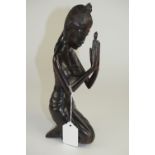 Indonesian - 20th Century Signed Wood Carving of a Young Woman In a Kneeing Position.