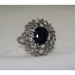 Ladies 1950's Platinum Set Diamond and Sapphire Cluster Ring, with Large Flower head Setting. The