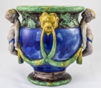 A 19th Century Majolica Jardiniere with Moulded Cherubs and Lion Masks. c.1870. Lozenge to