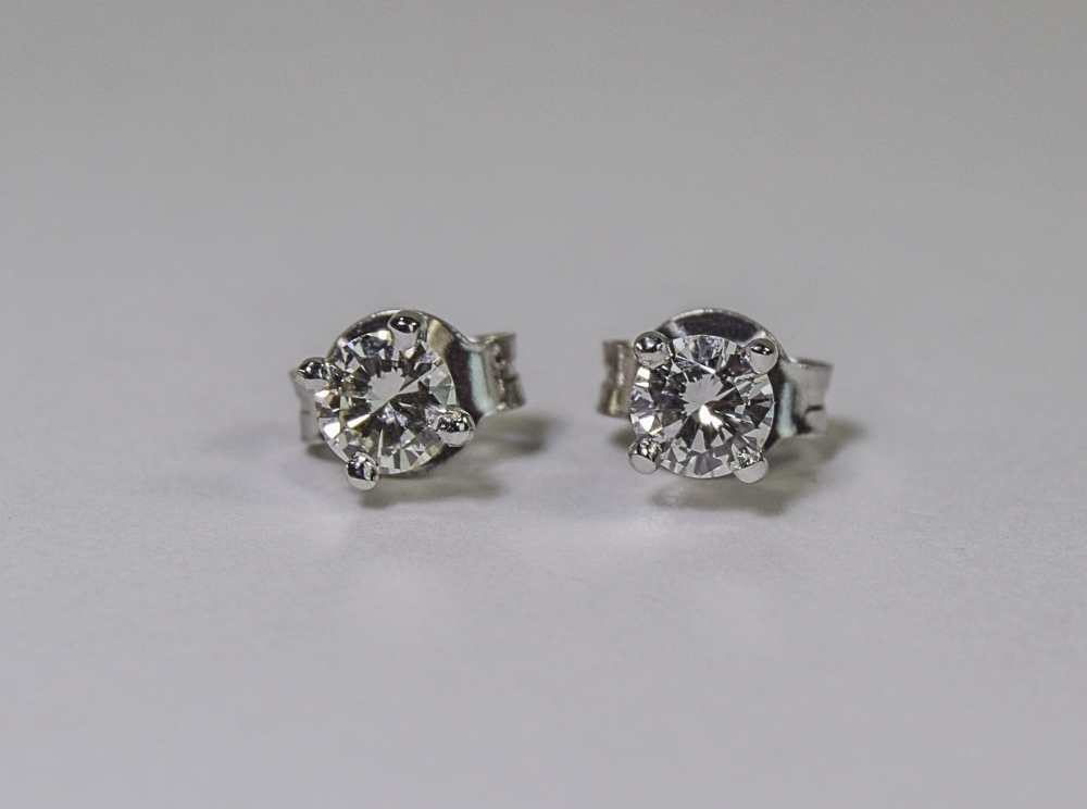 Pair Of 18ct White Gold Diamond Stud Earrings, Each Set With A Round Modern Brilliant Cut Diamond In