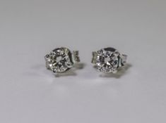 Pair Of 18ct White Gold Diamond Stud Earrings, Each Set With A Round Modern Brilliant Cut Diamond In