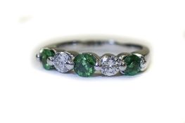 18ct White Gold Diamond And Emerald Dress Ring Set With 3 Round Cut Emeralds Between 2 Round