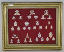 Display Frame Containing Modern British Army cap badges and collar badges.