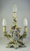 A German Late 19th Century Hand Painted Porcelain Figural 3 Branch Candelabra, The Central Venus