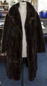 Ladies Brown Three Quarter Length Mink Coat, with three quarter length sleeves.