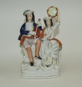Mid 19th Century Staffordshire Figure - Man and Woman Playing Musical Instruments, Sitting on a