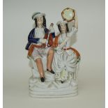 Mid 19th Century Staffordshire Figure - Man and Woman Playing Musical Instruments, Sitting on a