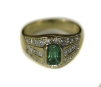 18ct Gold Emerald And Diamond Cluster Ring Set With A Central Emerald Between Eight Princess Cut