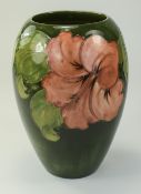 Moorcroft Ovoid Shaped Vase ' Coral Hibiscus ' Design on Green Ground.