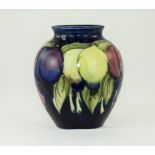 William Moorcroft Bulbous Shaped Vase ' Wisteria ' Plums Design on Blue Ground. c.1925. Full