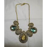 Sea Blue Crystal Piece and Antique Gold Metal Statement Necklace, comprising three pear cut sea blue