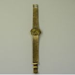 Tissot - Mechanical Wind 9ct Gold Ladies Wrist Watch with Integral 9ct Gold Mesh Bracelet.