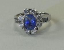 Ladies Fine Quality 18ct White Gold Set Sapphire and Diamond Cluster Ring.