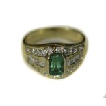 18ct Gold Emerald And Diamond Cluster Ring Set With A Central Emerald Between Eight Princess Cut