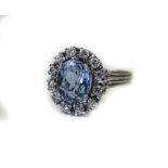 18ct White Gold Aquamarine And Diamond Cluster Ring Central Oval Cut Aquamarine Surrounded By 12