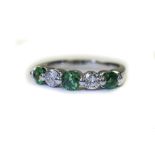 18ct White Gold Diamond And Emerald Dress Ring Set With 3 Round Cut Emeralds Between 2 Round