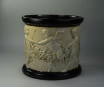 Bretby Clanta Ware Jardiniere, with a continuous relief of dancing putti,