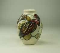 Moorcroft - Tubelined Modern Globular Shaped Vase, with Red Headed Bird and Corn Design. Date 2011.