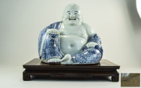 20thC Blue And White Laughing Buddha Figure, Impress Mark to Base, Raised On A Square Wooden Stand,