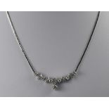 14ct White Gold Diamond Necklace Set With 6 Round Brilliant Cut Diamonds Between 5 Diamond Clusters