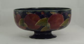 William Moorcroft Signed Footed Bowl, Pomegranates and Berries Pattern on Blue Ground. c.1916-1920.