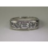 18ct White Gold Diamond Ring Set With A Central Baguette Between 2 Round Brilliant Cut Diamonds,