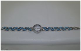 A Silver and Turquoise Set Ladies Wrist Watch with Mother of Pearl Dial and Crystal Set Bezel.