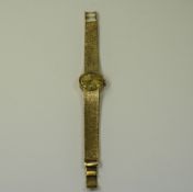 Tissot - Mechanical Wind 9ct Gold Ladies Wrist Watch with Integral 9ct Gold Mesh Bracelet.