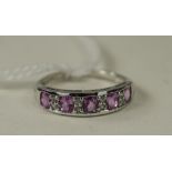 Pink Sapphire and White Zircon Band Ring, in 9ct white gold, having five oval cut pink sapphires,