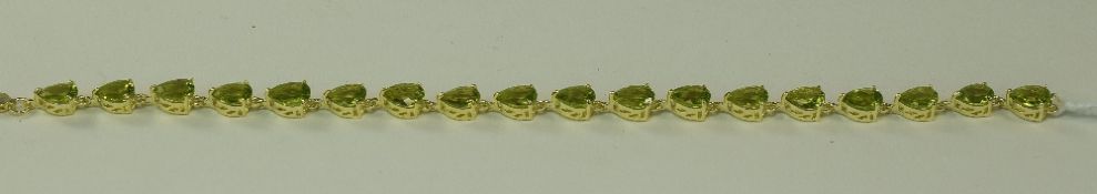 Peridot Pear Cut Tennis Bracelet, 21cts of pear cut peridots set in 14ct gold vermeil and silver,