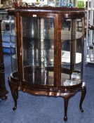 Mid To Late 20thC Mahogany Display Cabinet Of Shaped Form, Two Glass Shelves, Height 48 Inches,