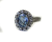 18ct White Gold Aquamarine And Diamond Cluster Ring Central Oval Cut Aquamarine Surrounded By 12