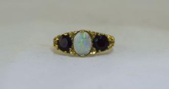 A Ladies - Nice Quality 9ct Gold Set Opal and Sapphire Dress Ring. Fully Hallmarked. 4.6 grams.