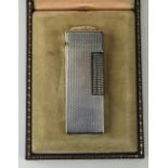 Dunhill Silver Cased Petrol Lighter with Original Box. U.S. Reg 24153. 2.5 Inches High.