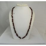 A Jasper and Cultured Pearl Necklace, 33