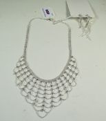White Crystal Scalloped Bib Necklace and Drop Earrings, rows of loops in a millegrain finish,