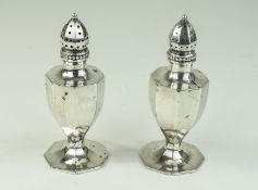 A Vintage Pair of Silver Pepperettes, Fluted Body's. Marked Sterling Silver. Each 3.75 Inches High.