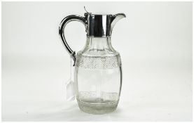 Victorian Silver Handled and Mounted Cut Glass Claret Jug with Pineapple Cut Bands.