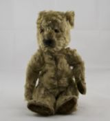 A 1920's / 1930's Mohair Teddy Bear, Straw Filled, Glass Eyes, Black Stitched Nose and Mouth.