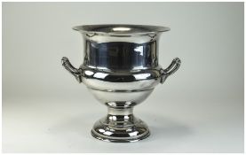 A Large Silver on Copper Twin Handle Champagne Ice Bucket. 9.75 Inches High. 8.5 Inches Diameter.