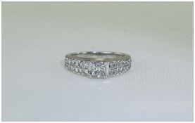 18ct White Gold Diamond Cluster Ring Set With A Central Princess Cut Diamond Between 28 Round