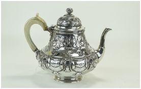 Mid Victorian Ornate and Fine Embossed Silver Teapot with Ivory Handle.