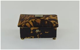 A Small Tortoiseshell Silk Lined Box with Ivory Feet.