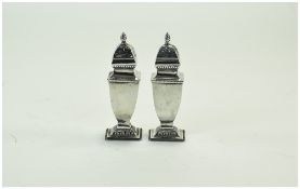 Victorian Pair of Tapered Silver Pepperettes with Framed Finials and Fluted Border.