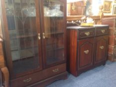 Two Modern Dark Wood Cabinets.