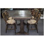 Ercol Dark Oak Table And Four Matching Spindle Back Chairs