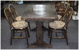 Ercol Dark Oak Table And Four Matching Spindle Back Chairs