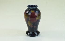 William Moorcroft Small Vase, Pomegranates And Berries Design On Blue Ground Circa.