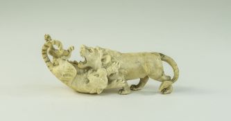 A Carved Ivory / Bone Lion and Tiger In a Fighting Pose. 1.5 Inches High, 4.5 Inches Long.