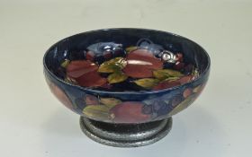 William Moorcroft and Tudrig - Planished Pewter Based Pedestal Bowl ' Pomegranate and Berries ' c.